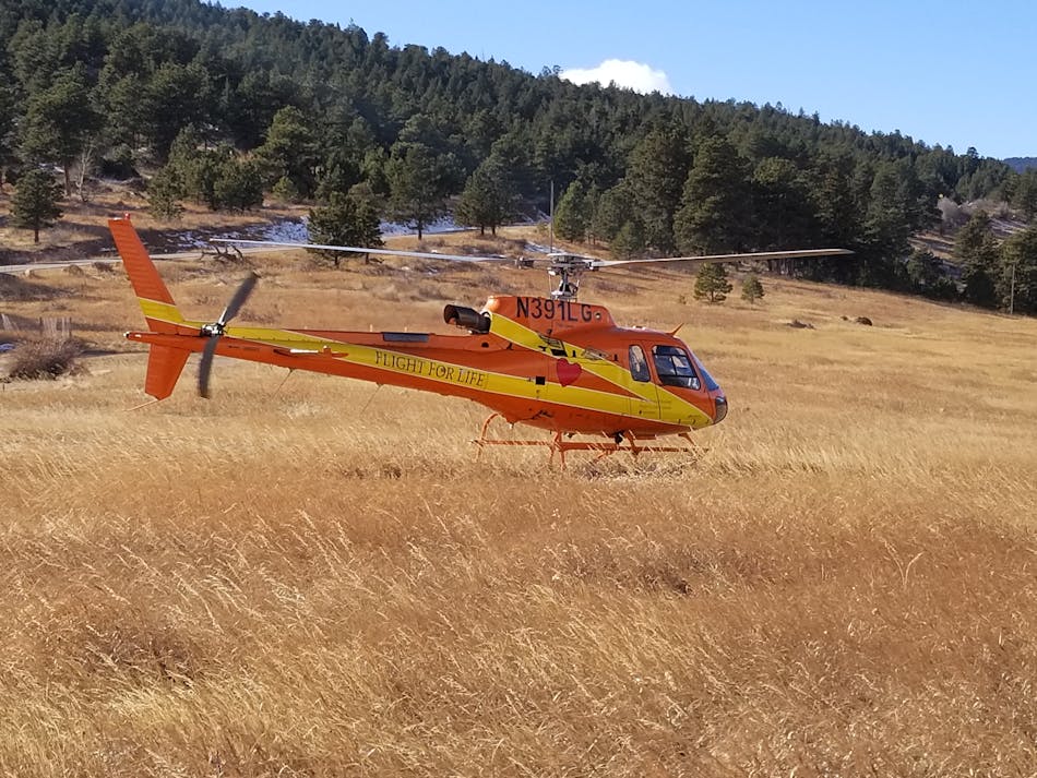 Flight for Life Colorado on an incident standby. Large fields like this work well for landing zones but can be complicated with more trees or site work.